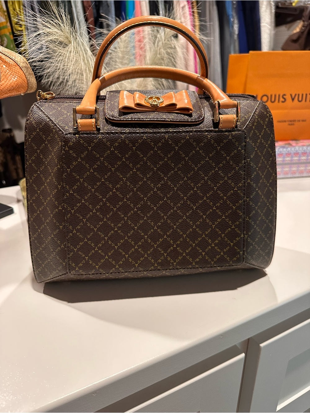 Brown Patterned Satchel with Tan Trim and Bow Accent